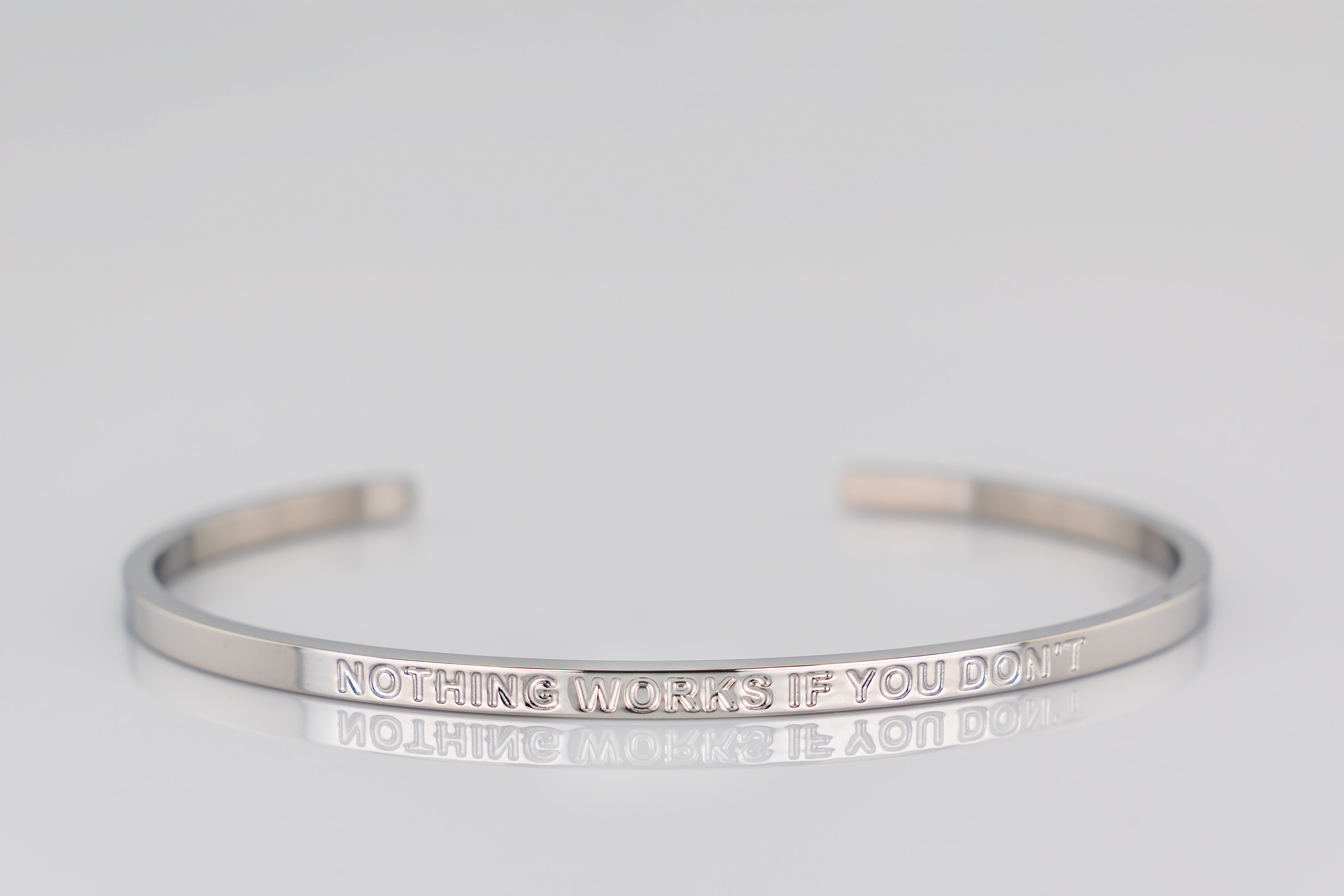 "NOTHING WORKS IF YOU DON'T" cuff bracelet