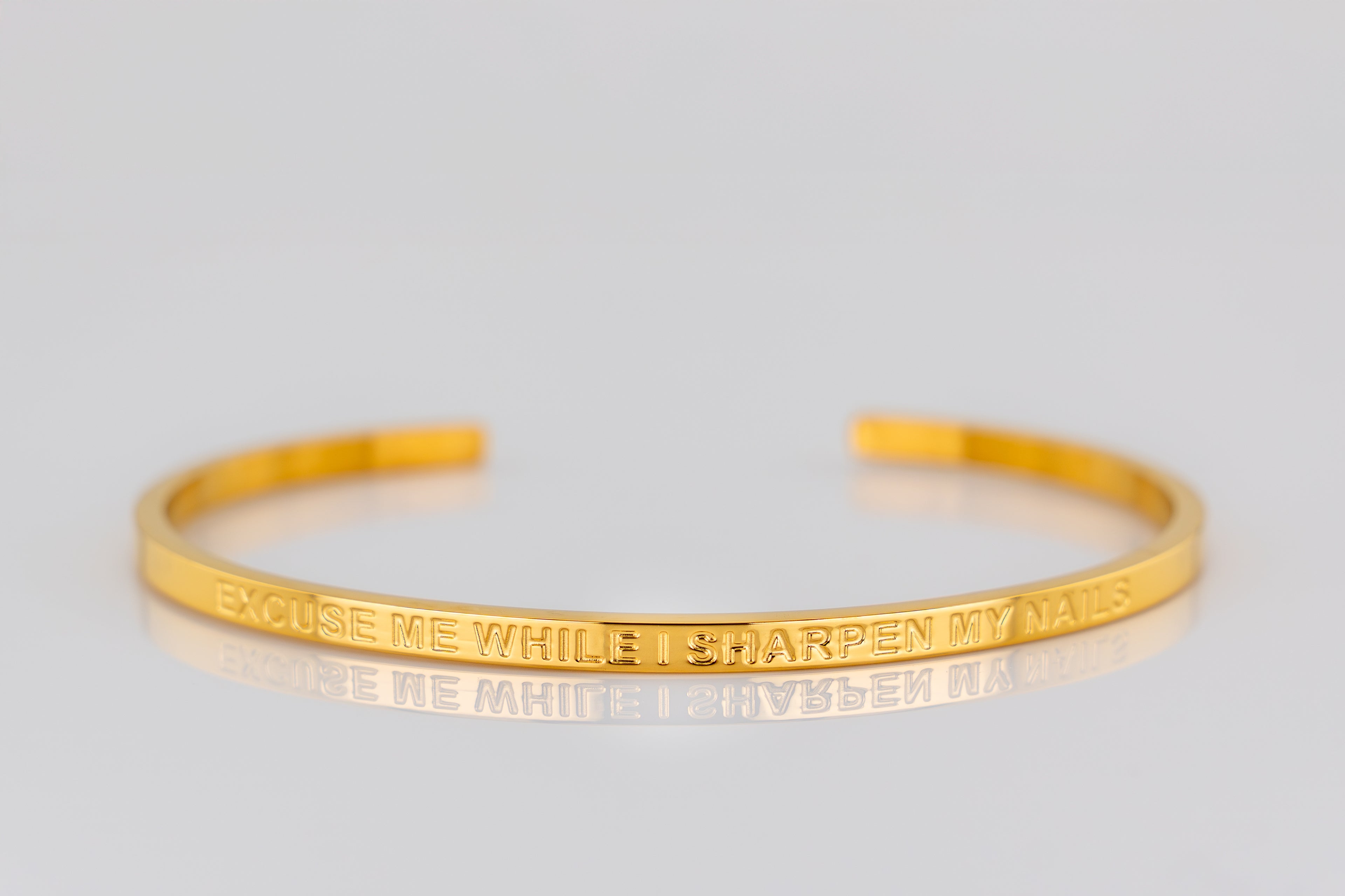 "EXCUSE ME WHILE I SHARPEN MY NAILS" cuff bracelet