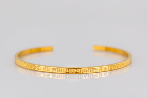 "EXCUSE ME WHILE I SHARPEN MY NAILS" cuff bracelet