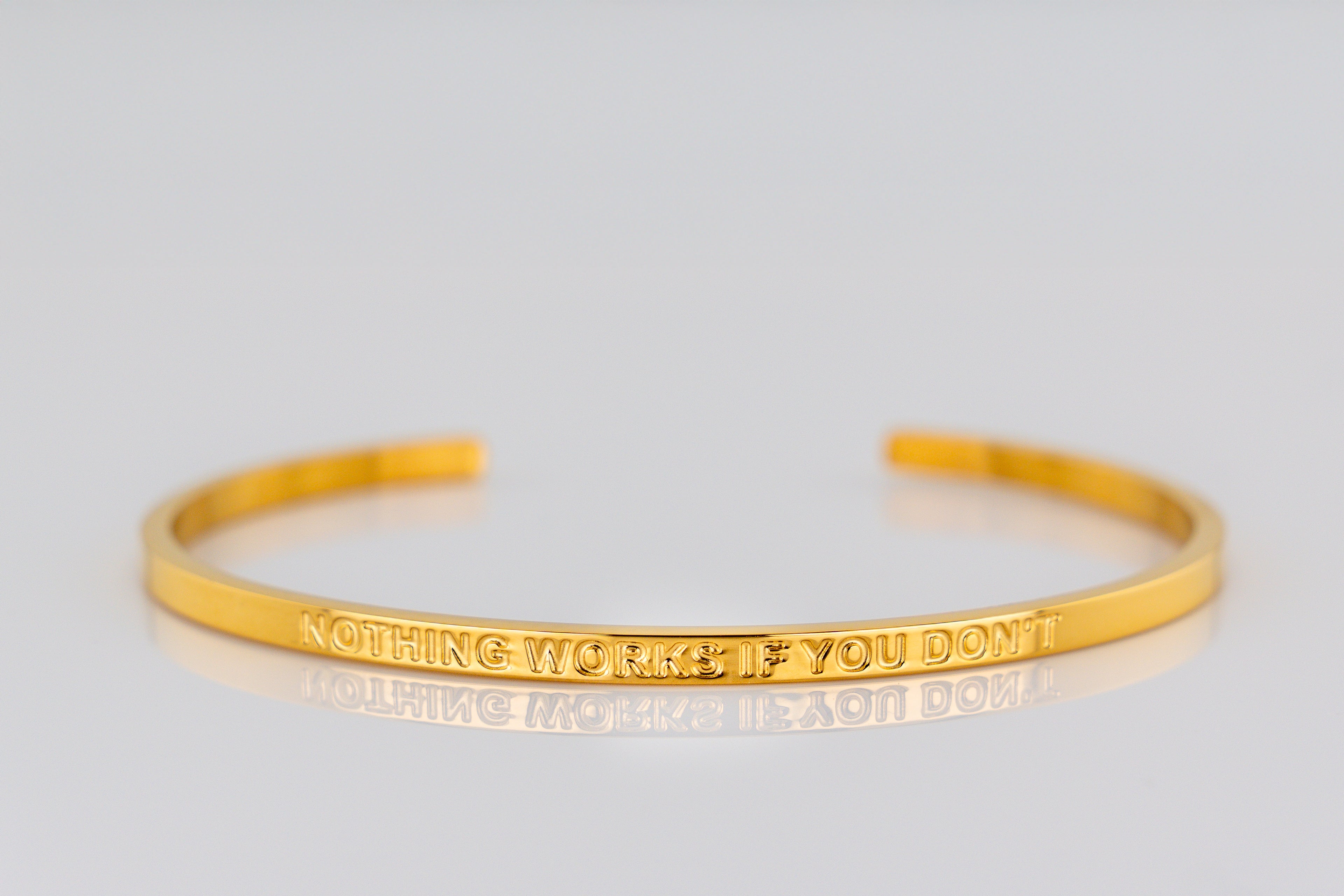 "NOTHING WORKS IF YOU DON'T" cuff bracelet