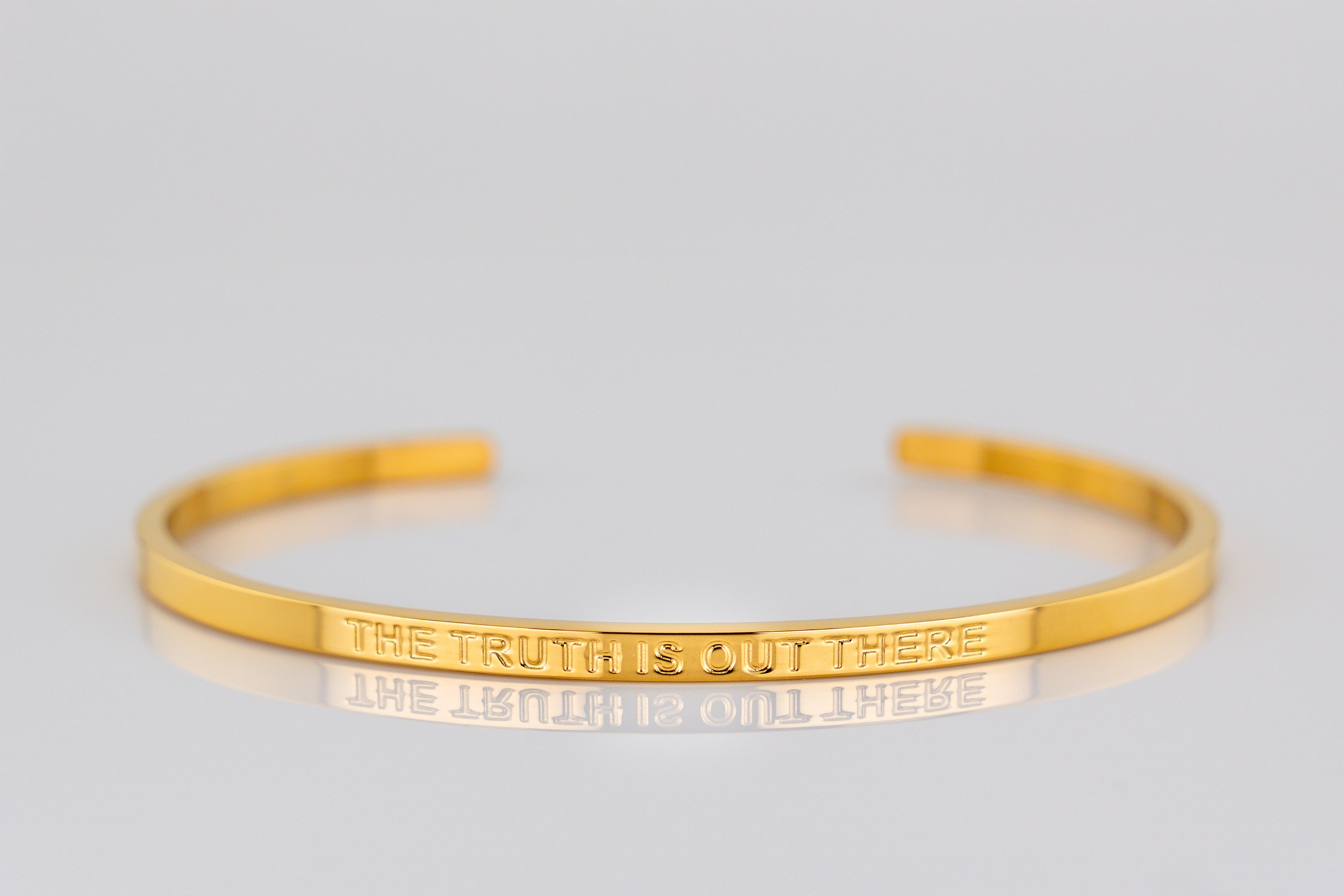 "THE TRUTH IS OUT THERE" cuff bracelet